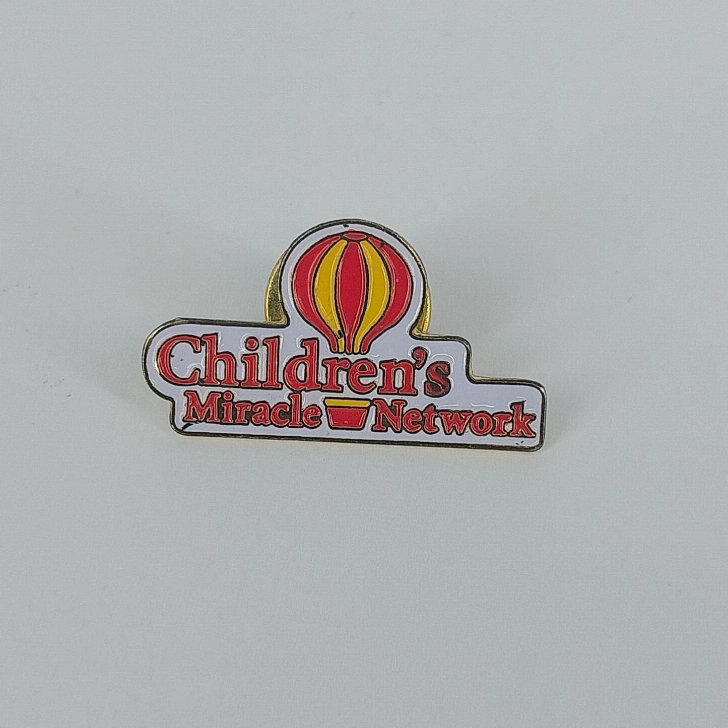Vintage Children's Miracle Network balloon logo enamel lapel pin