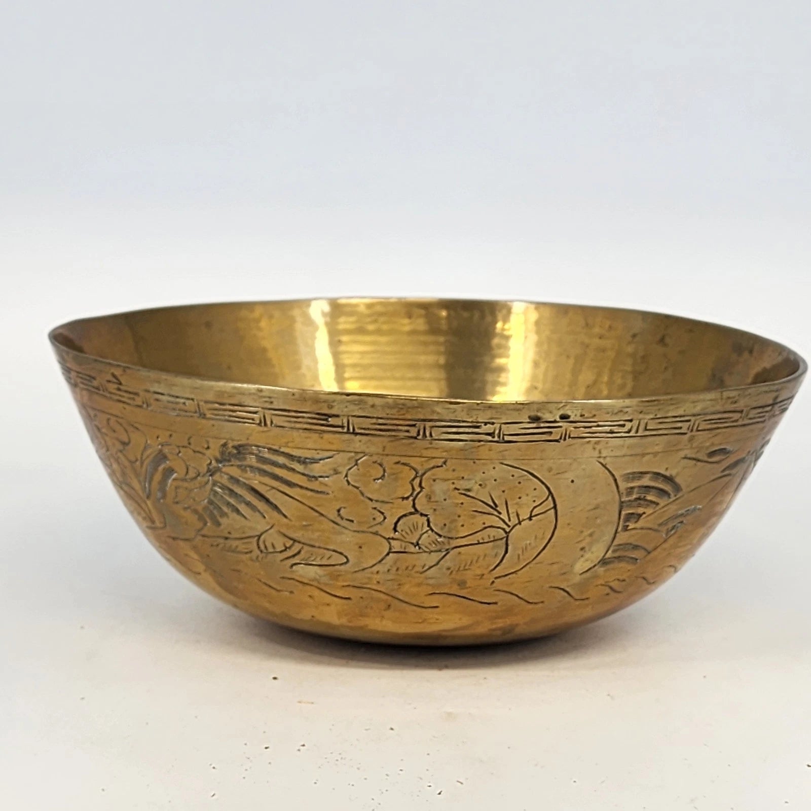 Engraved brass bowl with dragon and phoenix design gold tone finish