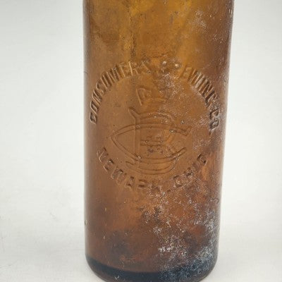 Vintage 10 inch dark amber Consumers Brewery Co beer bottle from Newark Ohio