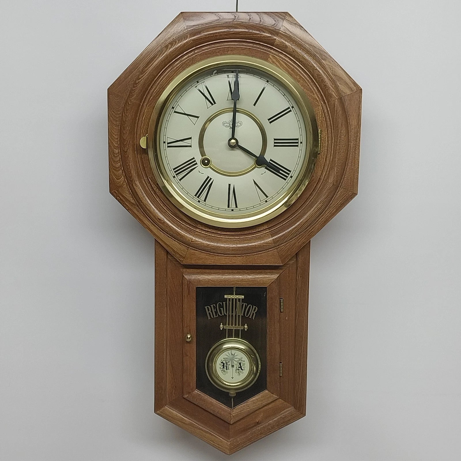 D&A regulator wall clock with octagon face and Westminster chime movement