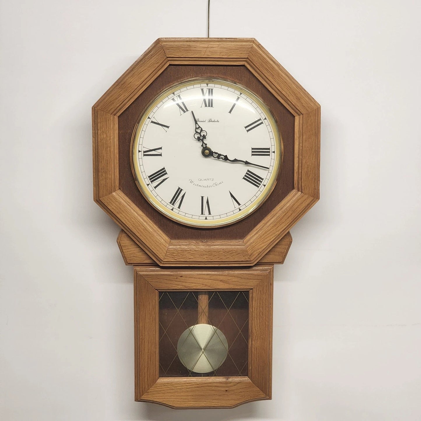 Daniel Dakota octagon oak wall clock with pendulum and Westminster chime