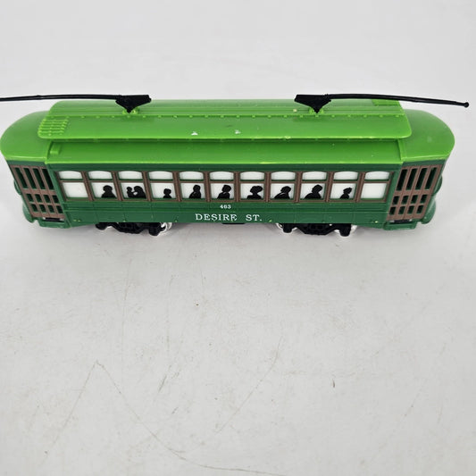 Green plastic vintage streetcar trolley toy with wheels Desire Street