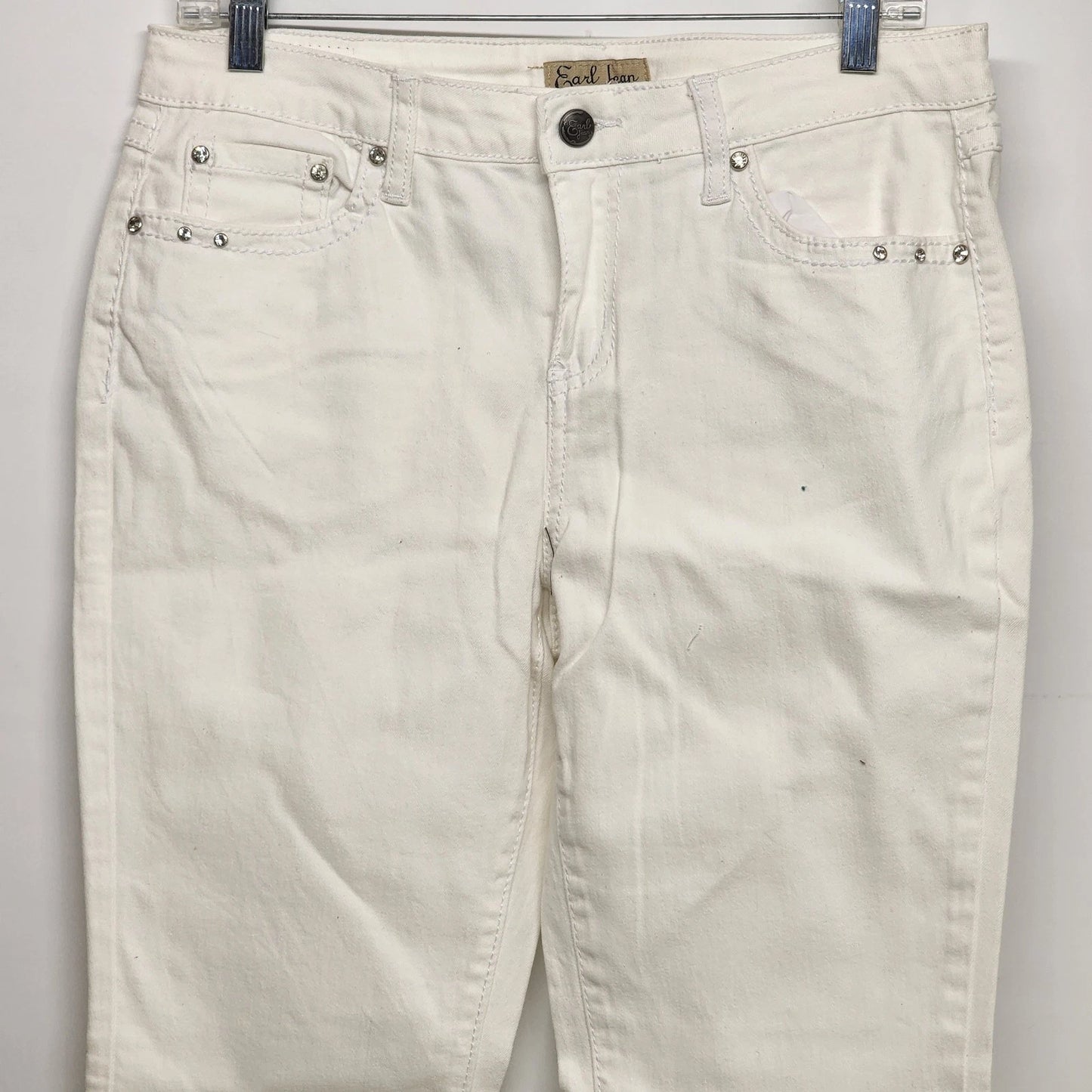 White straight leg denim jeans with rhinestone accents