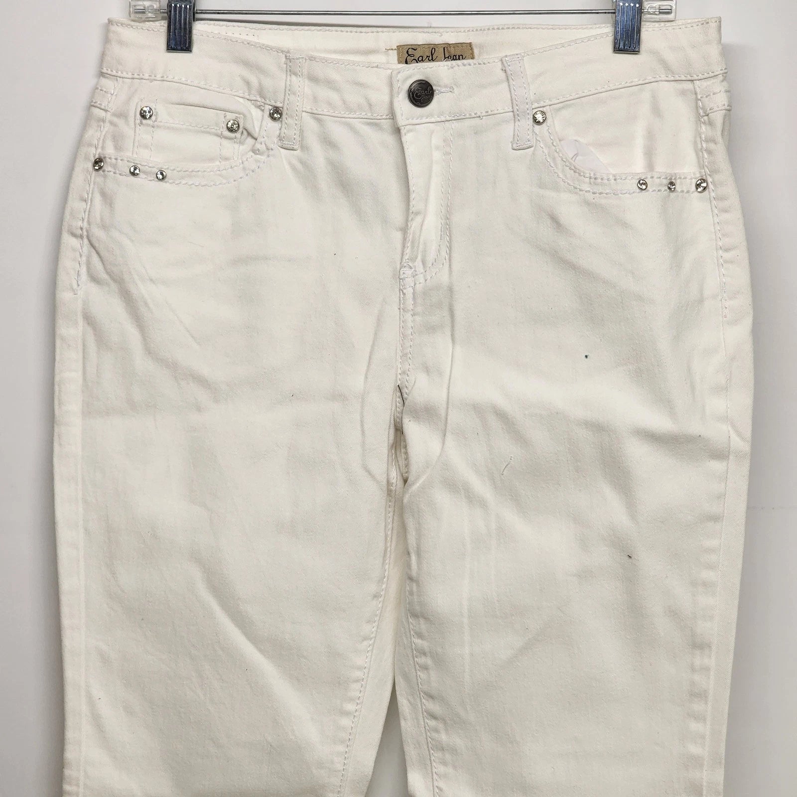 White straight leg denim jeans with rhinestone accents