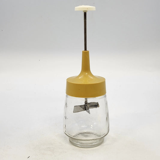 Vintage Federal Housewares glass food chopper with yellow lid and white handle