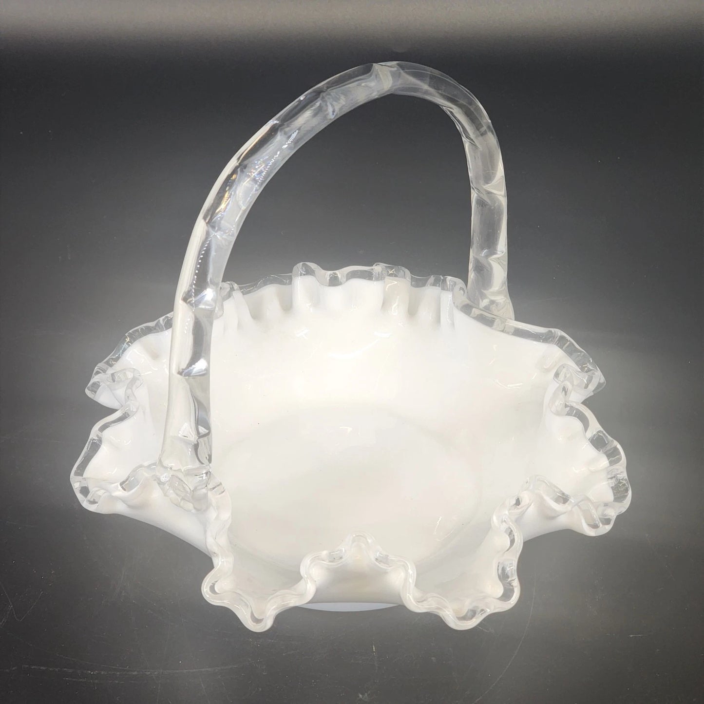 Fenton Silver Crest milk glass basket with ruffled edge and handle