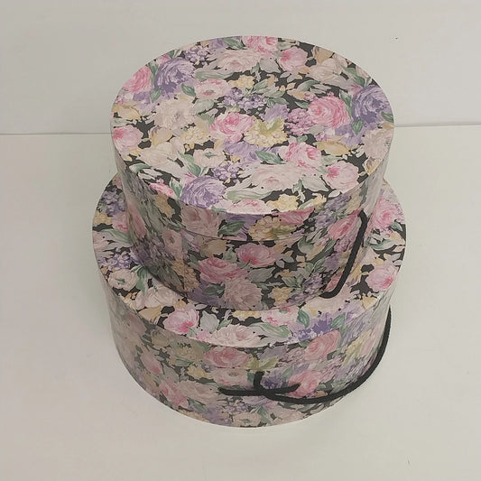 Set of two floral nesting round hat storage boxes with handles