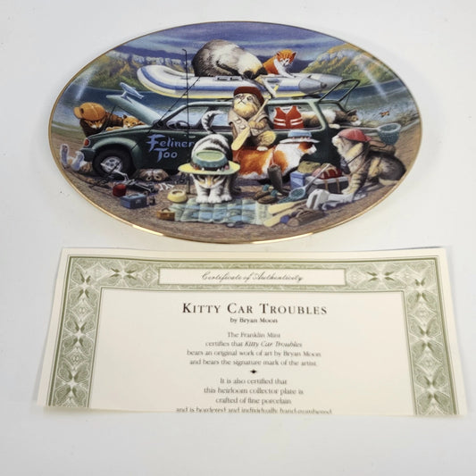 Franklin Mint Kitty Car Troubles limited edition porcelain collector plate featuring Bryan Moon's humorous cat travel scene, gold-tone rim, and Certificate of Authenticity.