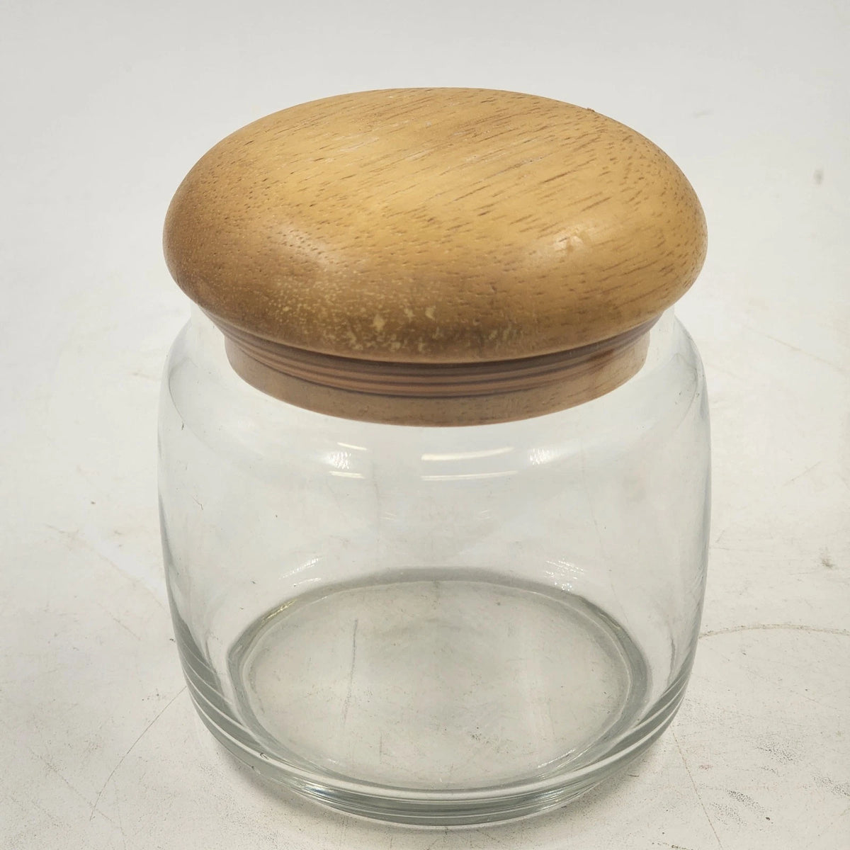 Clear glass storage jar with teak mushroom wood lid and airtight seal