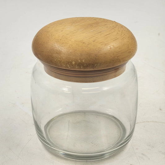 Clear glass storage jar with teak mushroom wood lid and airtight seal