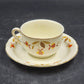 Hall China Autumn Leaf ruffled D flat cup and saucer set