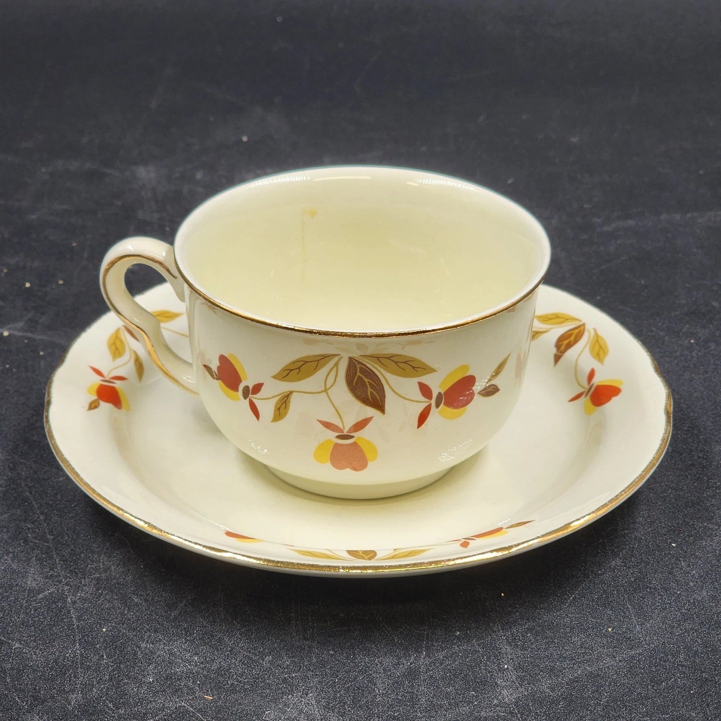 Hall China Autumn Leaf ruffled D flat cup and saucer set