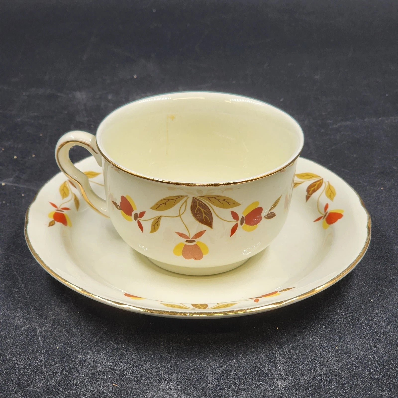 Hall China Autumn Leaf ruffled D flat cup and saucer set