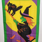 Yellow Halloween yard flag with flying witch on broom and black cat