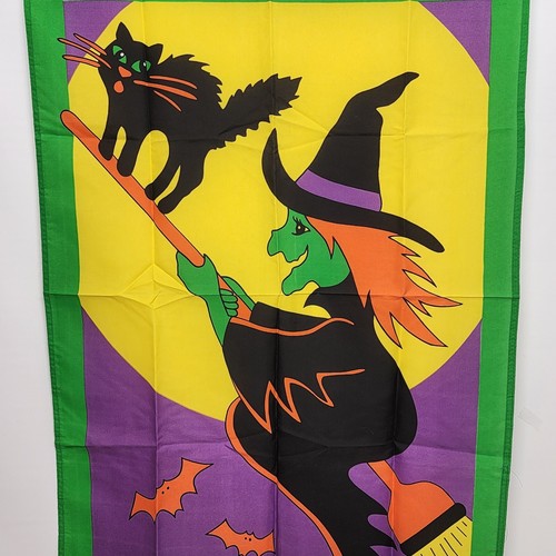 Yellow Halloween yard flag with flying witch on broom and black cat