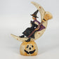 Halloween witch figurine with black cat on crescent moon and jack o lantern base