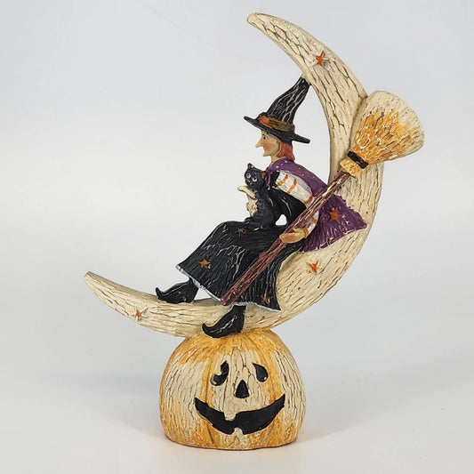 Halloween witch figurine with black cat on crescent moon and jack o lantern base