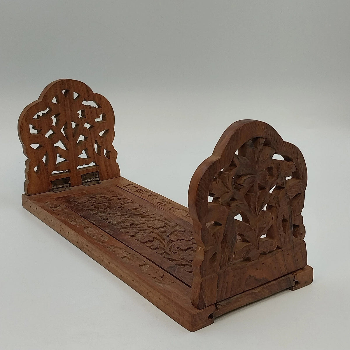 Hand carved wooden expandable book rack with floral bookends