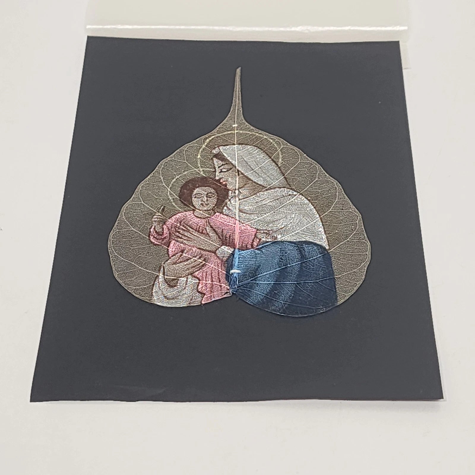 Hand painted Madonna and Child artwork on a genuine Peepal skeleton leaf