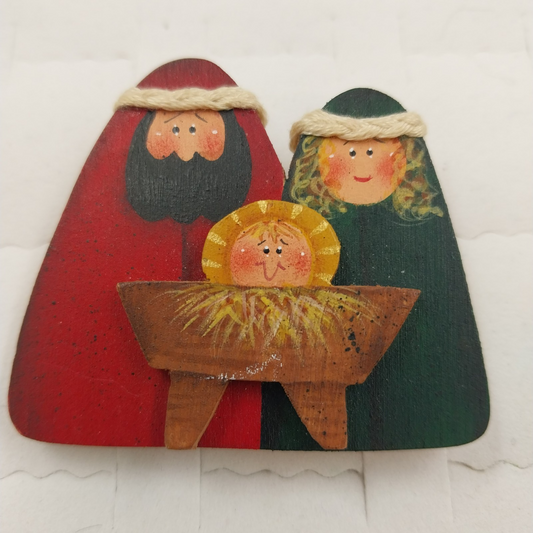 Hand-painted wooden nativity brooch featuring Mary Joseph and Baby Jesus