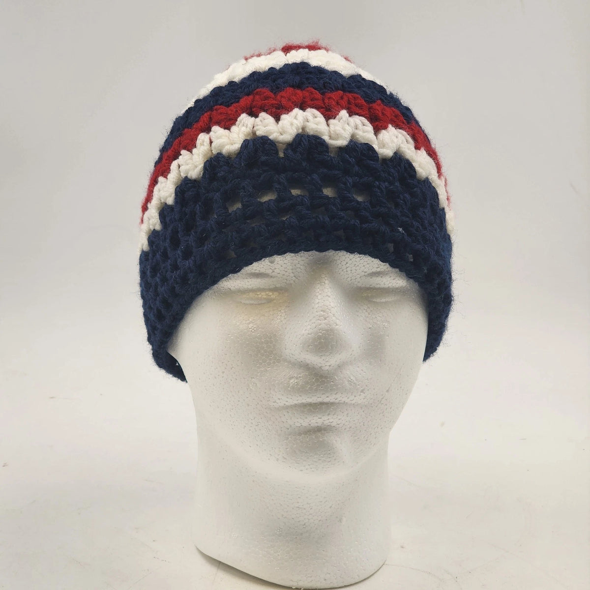 Handmade navy red and white crochet messy bun beanie