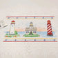Set of two white Heritage Lace placemats with nautical lighthouse design