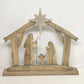 Rustic wood nativity silhouette with Joseph Mary and baby Jesus
