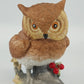Horned owl porcelain figurine on log with holly berries