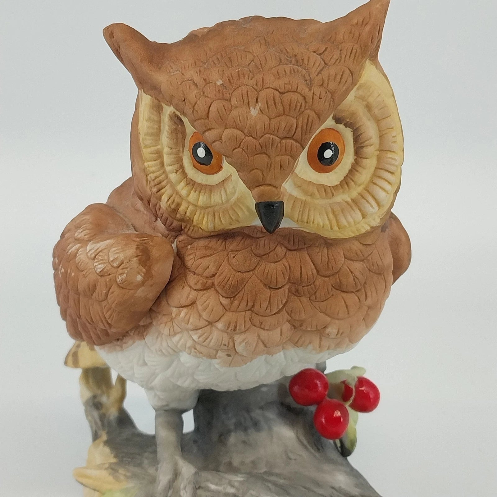 Horned owl porcelain figurine on log with holly berries