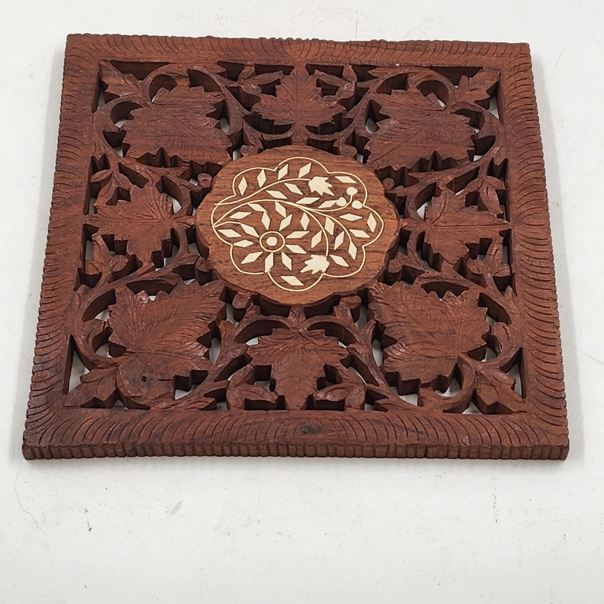 Vintage Indian hand carved wood trivet with floral gold inlay