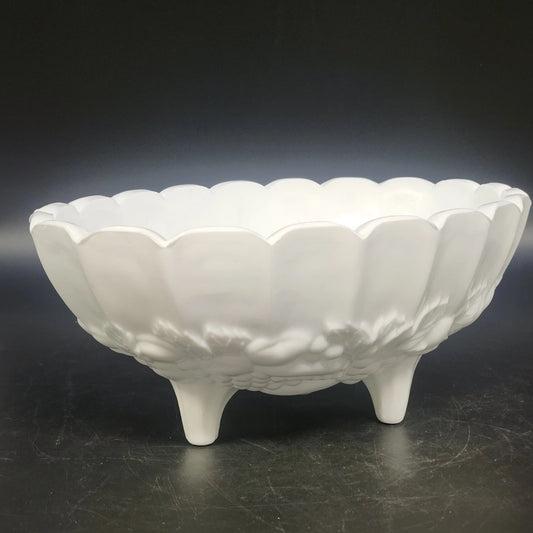 White Indiana Glass Harvest Grape oval bowl with embossed floral details, scalloped rim, and three feet.