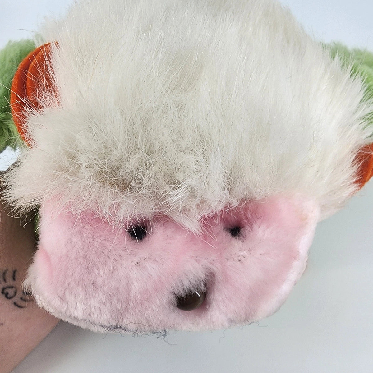 Vintage green Intrigue hanging monkey plush with loop hands