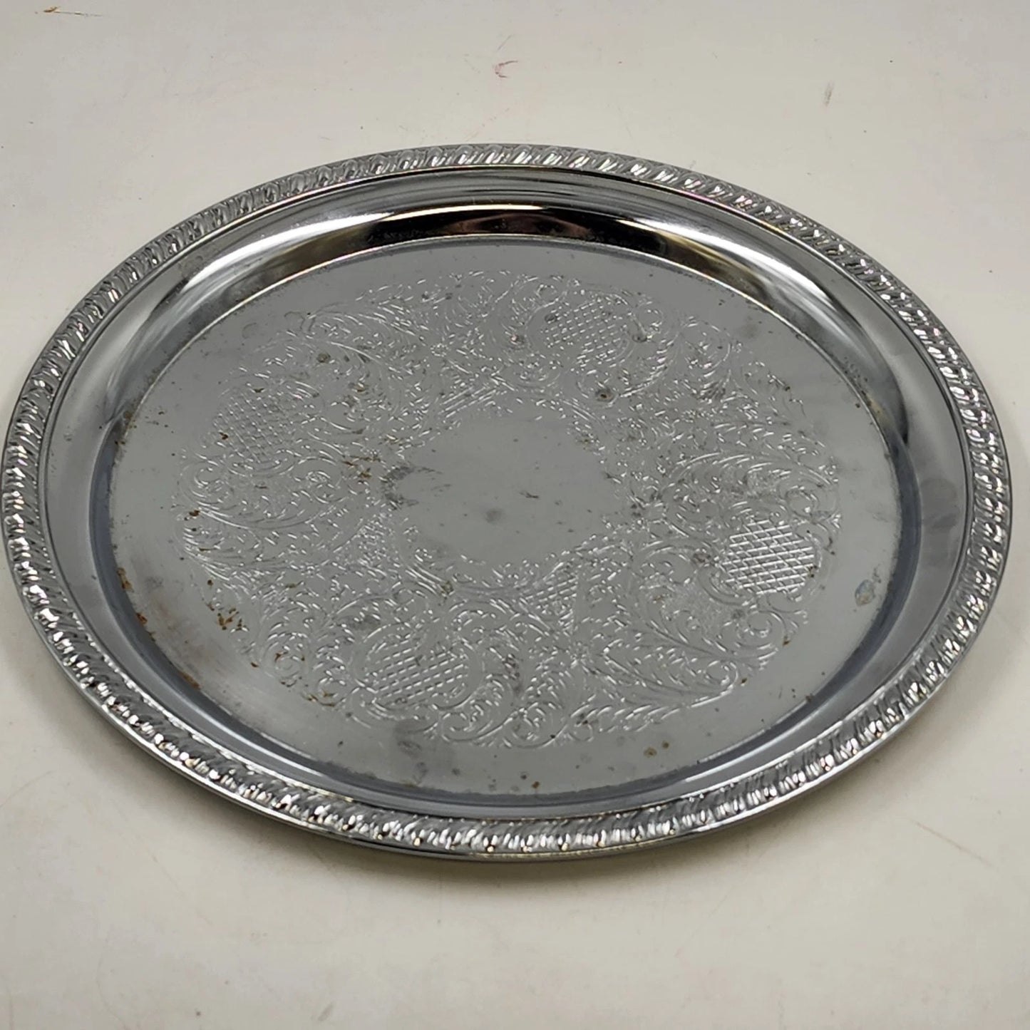 Irvinware silver plated round serving tray with etched scroll design