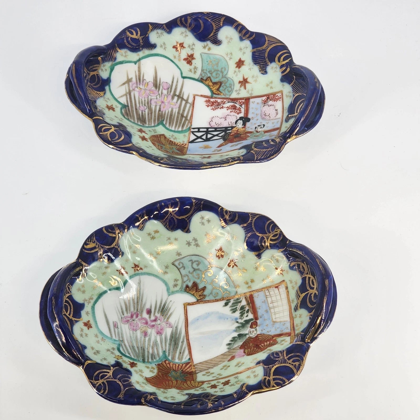 Set of two Japanese hand painted porcelain oval dishes with cobalt blue raised handles