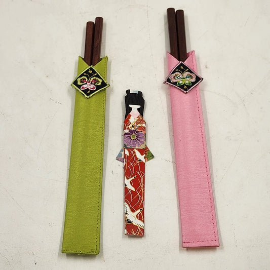 Japanese wooden chopsticks with kokeshi doll rests and embroidered fabric pouch set
