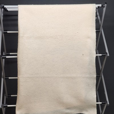 Khaki beige wool blend felt fabric pad measuring 40 by 40 inches