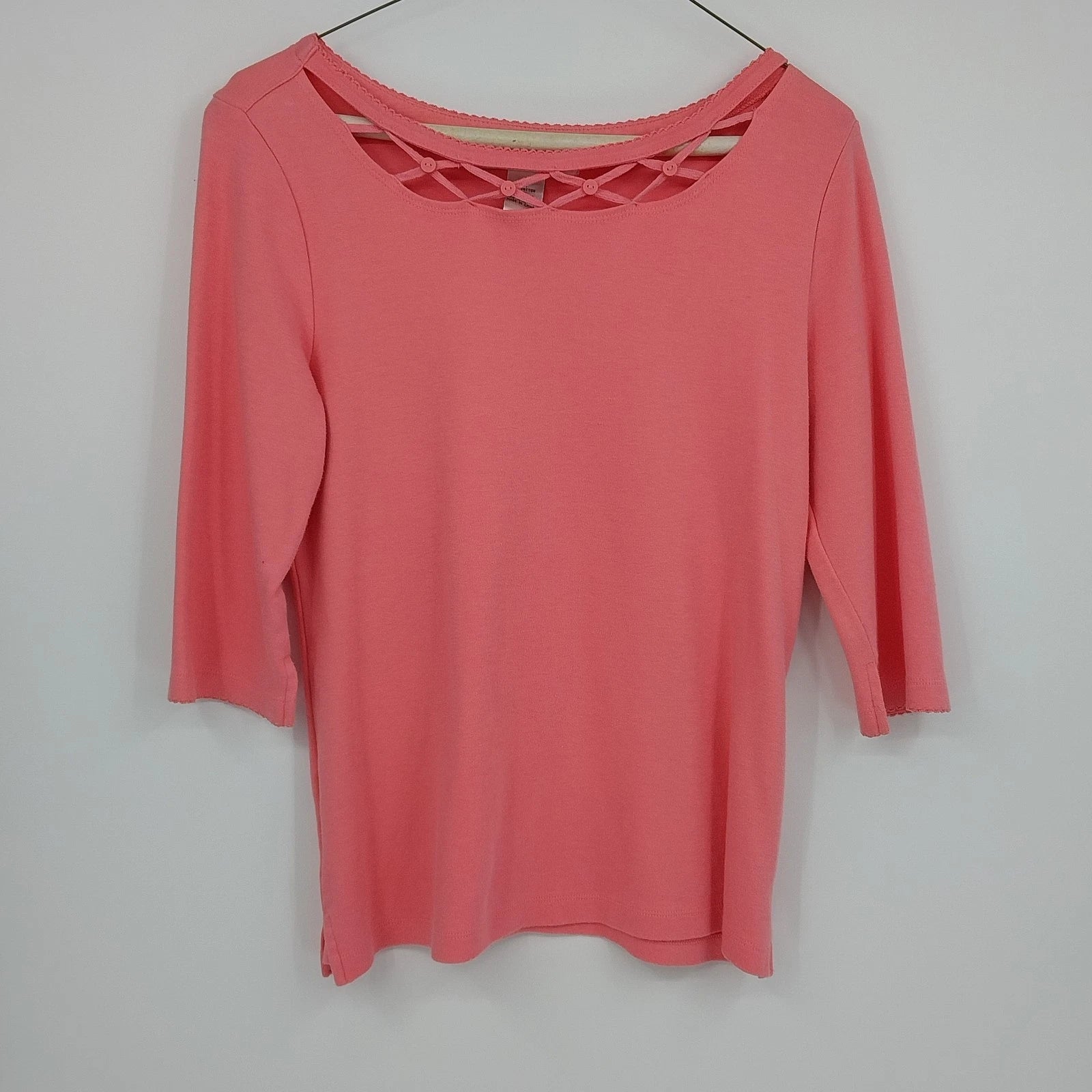 Kikit Sports women's coral pink top with criss cross neckline and 3/4 sleeves