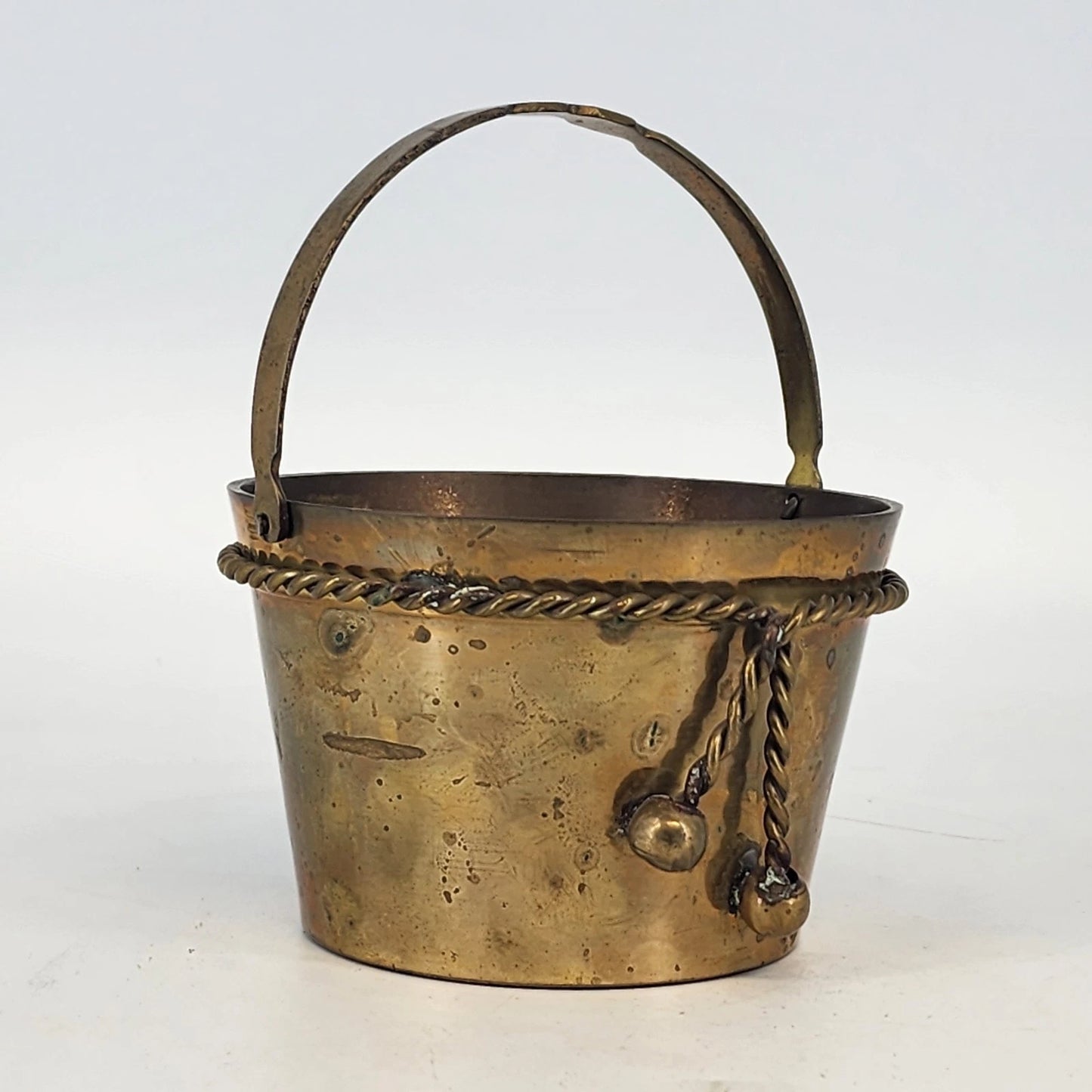 Vintage brass bucket basket with rope twist detail and handle