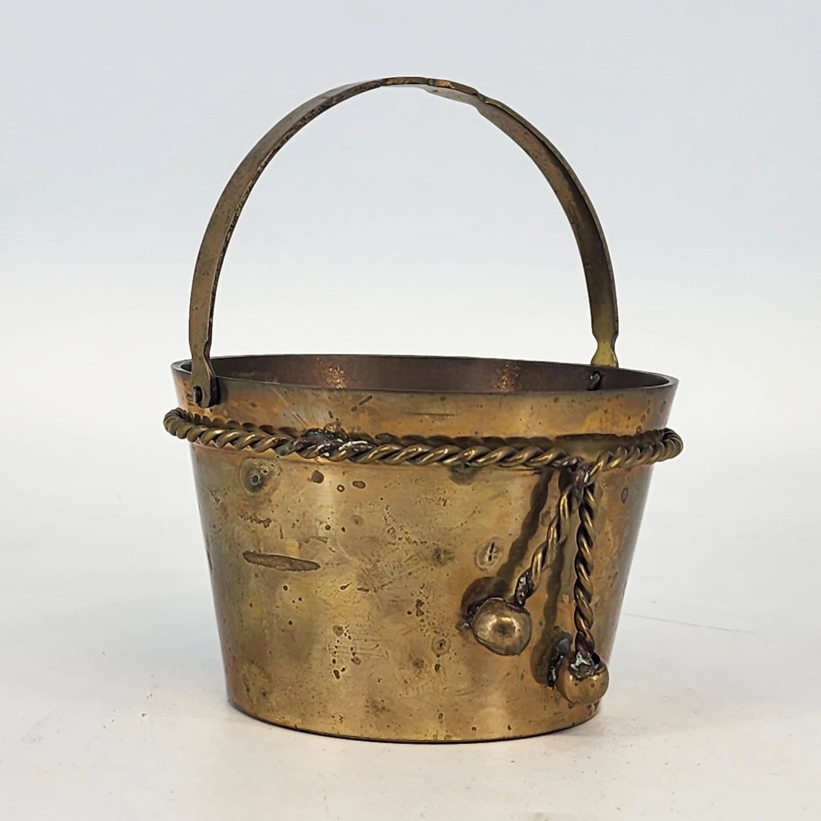 Vintage brass bucket basket with rope twist detail and handle