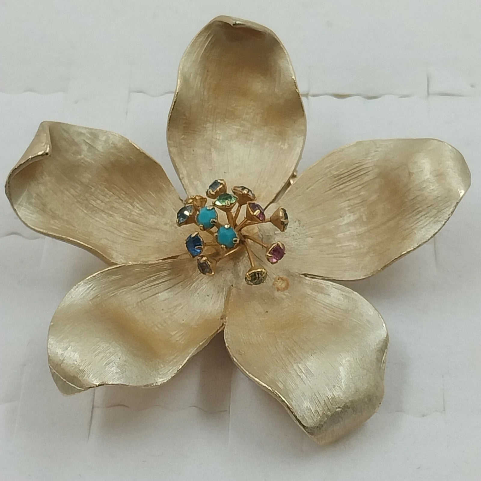 Kramer vintage gold tone flower brooch with rhinestones and cabochons