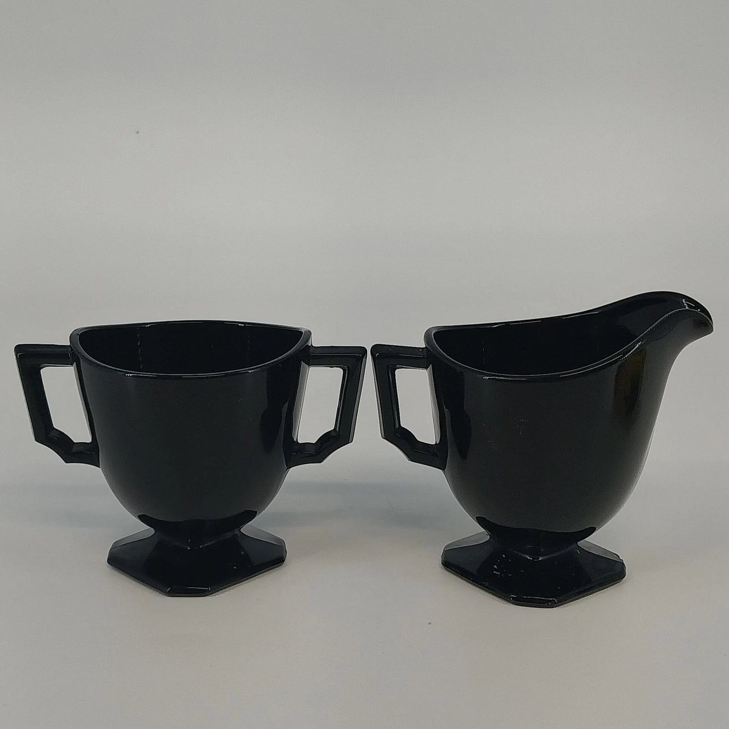 LE Smith black glass Double Shield cream and sugar set