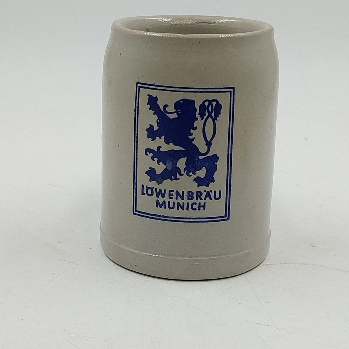 Vintage Löwenbräu München 0.5L stoneware beer stein with blue lion logo