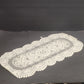 Oval off white lace table runner with floral crochet pattern