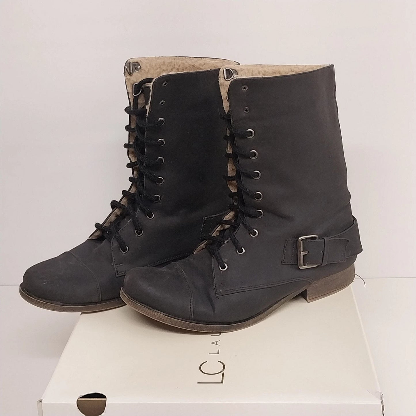 Black Lauren Conrad Reese combat boots with faux fur trim