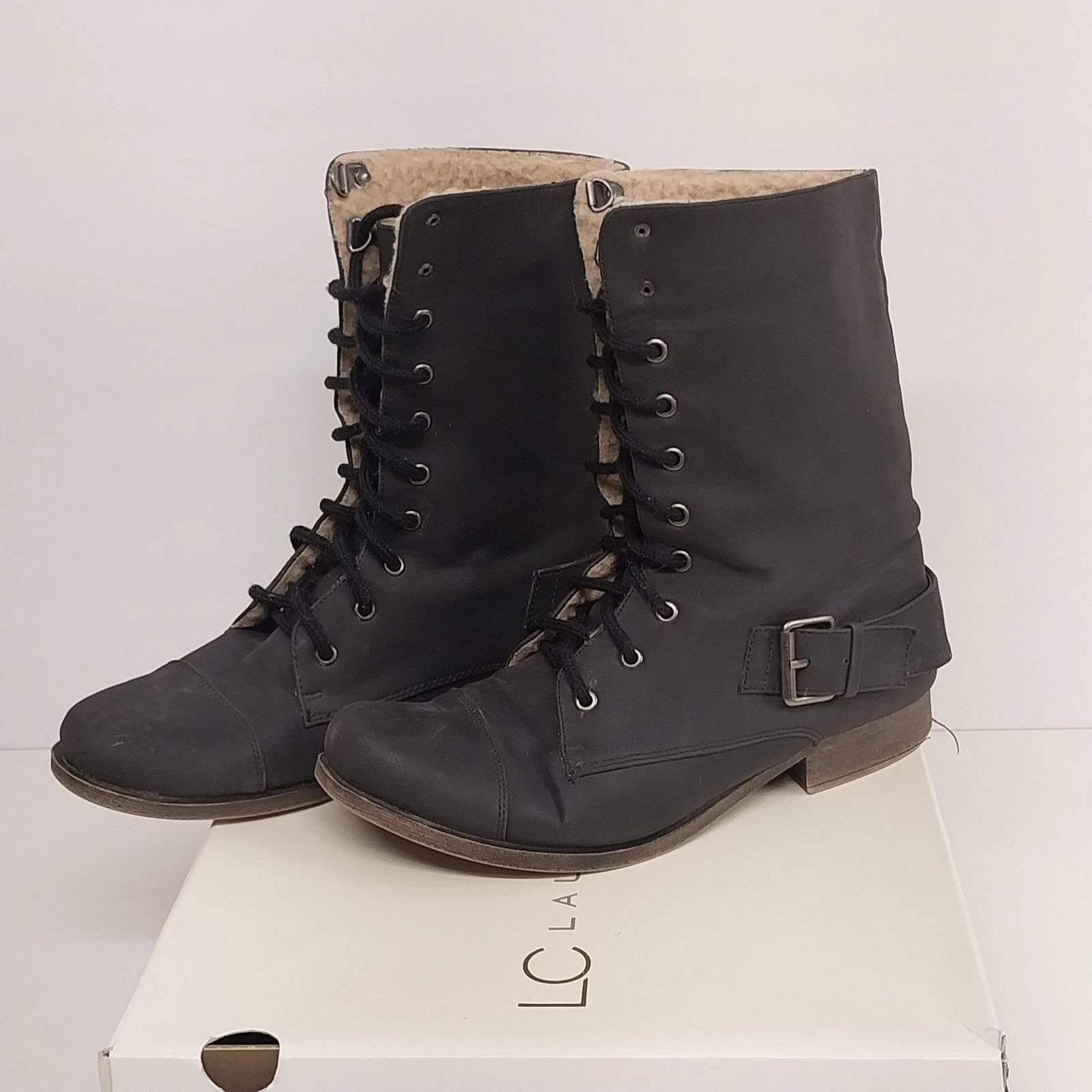 Black Lauren Conrad Reese combat boots with faux fur trim