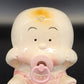 Vintage ceramic baby girl planter with pink bow and pacifier