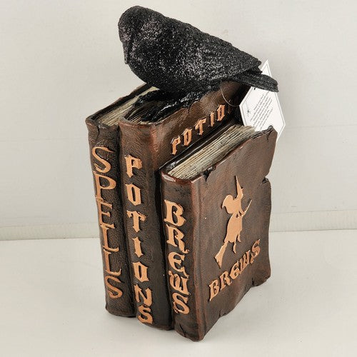 Martha Stewart Halloween figurine with black raven on stack of spell books