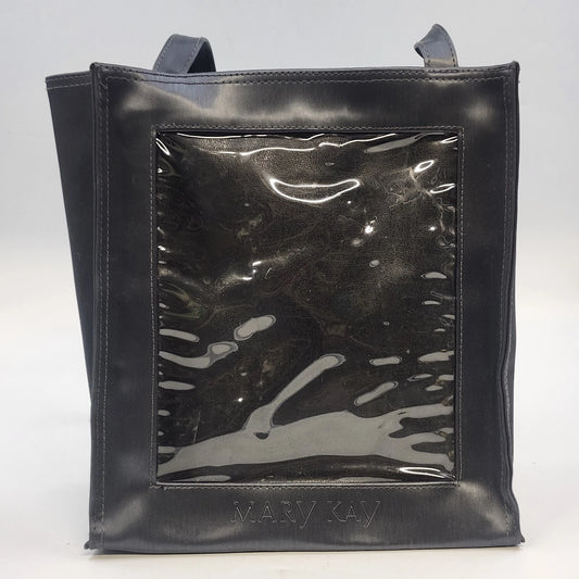 Black Mary Kay tote bag with a clear front window, open top, and dual shoulder straps.