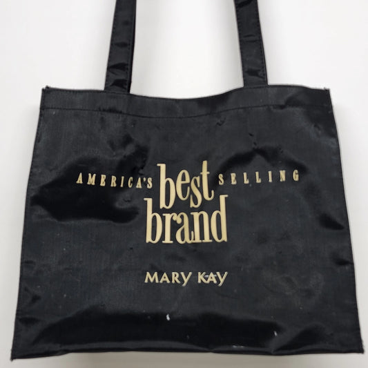 Black Mary Kay tote bag with gold America's Best Selling Brand lettering and dual handles.