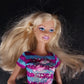 Mattel Barbie babysitter doll with blonde hair and striped dress